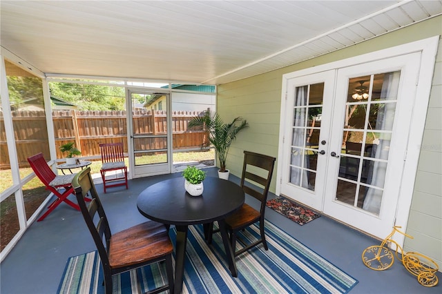 sunroom featuring outdoor dining space and french doors