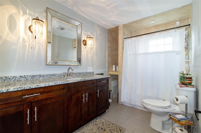 full bathroom featuring a shower with shower curtain, toilet, tile patterned flooring, and vanity