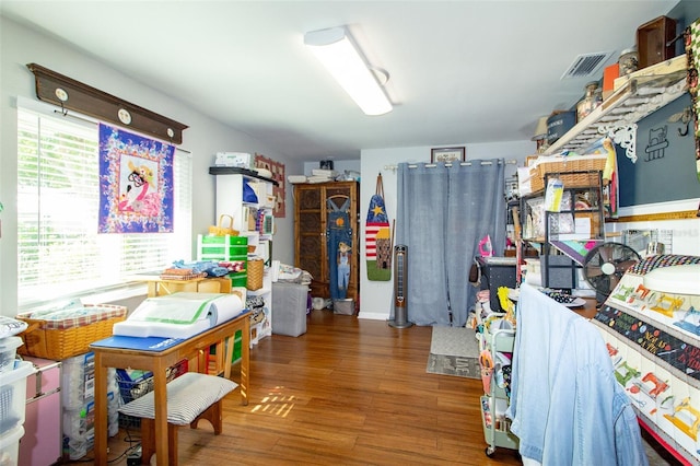 interior space featuring visible vents and wood finished floors