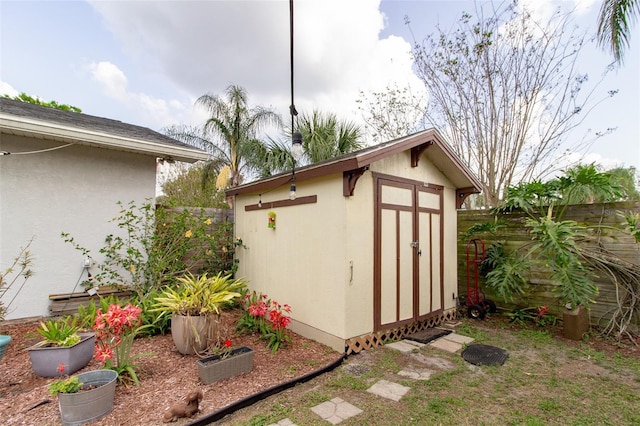 view of shed featuring a fenced backyard
