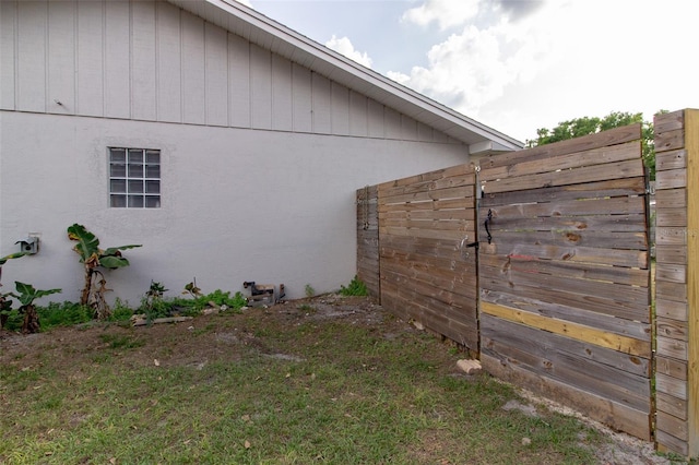 view of side of home with stucco siding