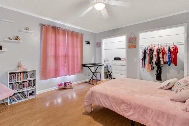202 Saint Lucie Rd, Winter Haven, FL 33884 - bedroom with wood finished floors, crown molding, baseboards, ceiling fan, and a closet