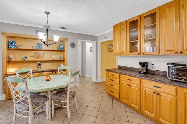 202 Saint Lucie Rd, Winter Haven, FL 33884 - kitchen with dark countertops, light tile patterned flooring, crown molding, a textured ceiling, and open shelves