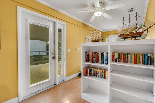 202 Saint Lucie Rd, Winter Haven, FL 33884 - sitting room featuring ornamental molding, a ceiling fan, wood finished floors, and baseboards