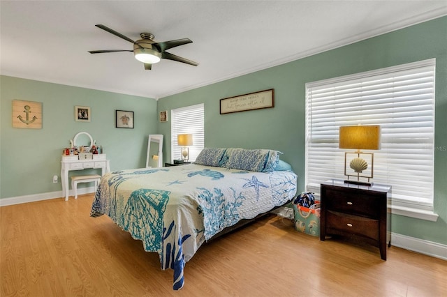 202 Saint Lucie Rd, Winter Haven, FL 33884 - bedroom featuring wood finished floors, crown molding, baseboards, and ceiling fan