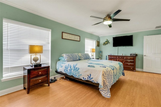 202 Saint Lucie Rd, Winter Haven, FL 33884 - bedroom featuring crown molding, light wood-style floors, baseboards, and ceiling fan
