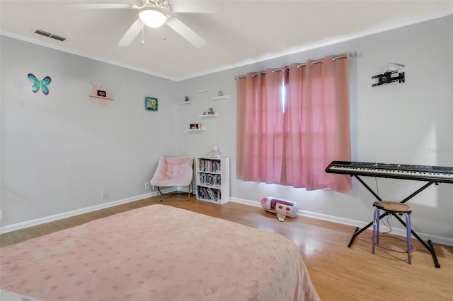 202 Saint Lucie Rd, Winter Haven, FL 33884 - bedroom with wood finished floors, crown molding, a ceiling fan, and baseboards