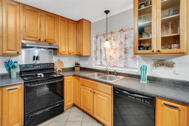 202 Saint Lucie Rd, Winter Haven, FL 33884 - kitchen with black appliances, a sink, under cabinet range hood, dark countertops, and light tile patterned flooring