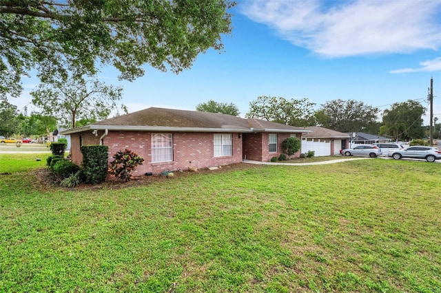 202 Saint Lucie Rd, Winter Haven, FL 33884 - ranch-style house featuring brick siding, a front yard, and a garage