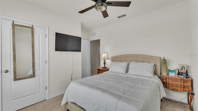 bedroom with carpet floors, baseboards, ceiling fan, and visible vents