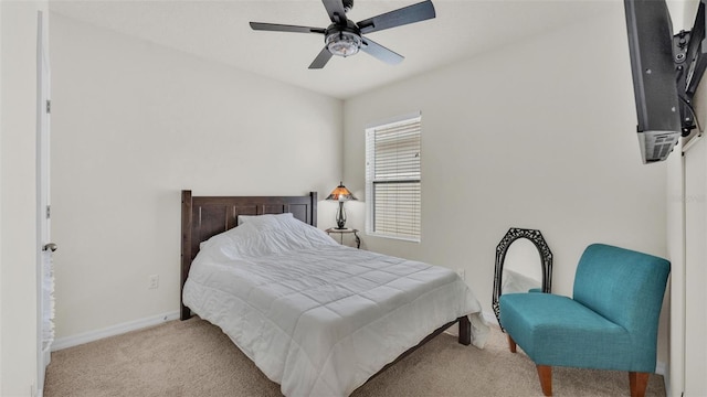bedroom with baseboards, carpet flooring, and a ceiling fan