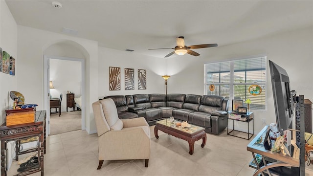 living area with visible vents, light tile patterned floors, and a ceiling fan