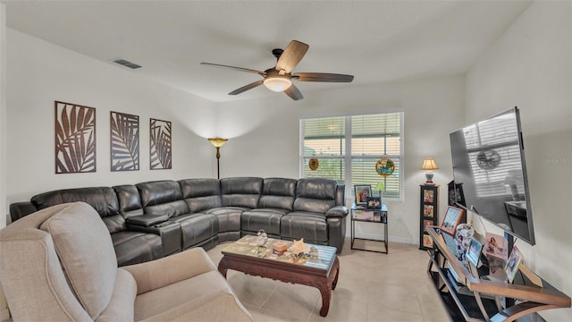 living area featuring a ceiling fan, light tile patterned floors, baseboards, and visible vents