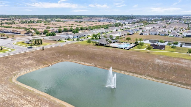 bird's eye view featuring a residential view and a water view