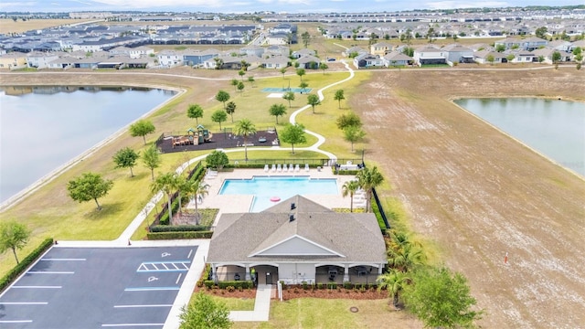 aerial view with a water view and a residential view