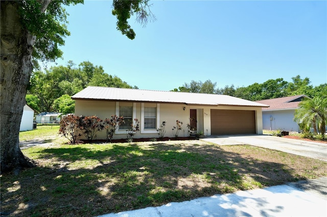 1618 Crystalview Trl, Lakeland, FL 33801 - ranch-style house featuring an attached garage, driveway, stucco siding, and a front lawn