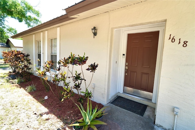 1618 Crystalview Trl, Lakeland, FL 33801 - doorway to property featuring stucco siding