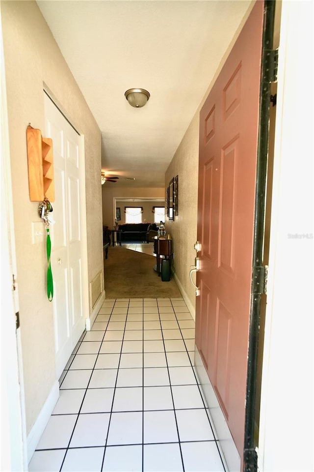 1618 Crystalview Trl, Lakeland, FL 33801 - hallway featuring baseboards and light colored carpet