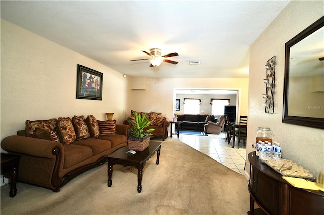 1618 Crystalview Trl, Lakeland, FL 33801 - living room featuring ceiling fan, light tile patterned floors, and light carpet