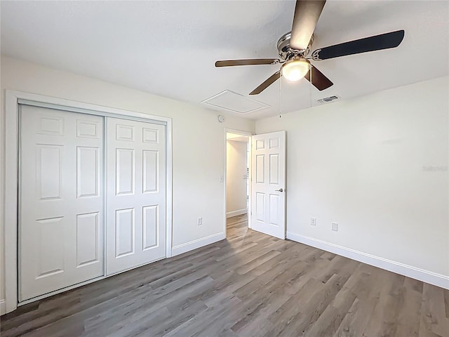 2042 Windward Pass, Lakeland, FL 33813 - unfurnished bedroom with baseboards, visible vents, a closet, and wood finished floors