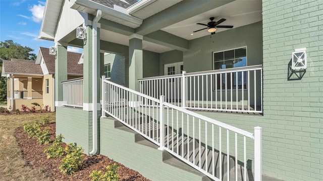 exterior space with a porch, stairs, and a ceiling fan