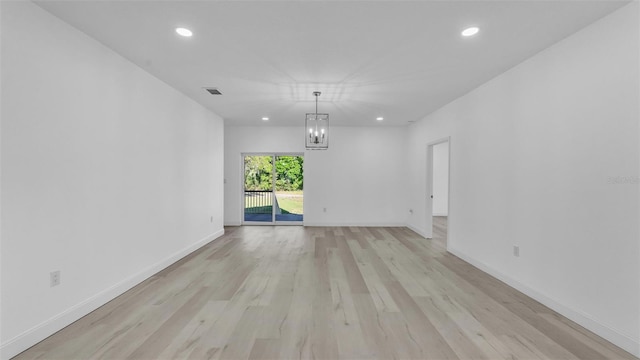 interior space with light wood-style floors, visible vents, and recessed lighting