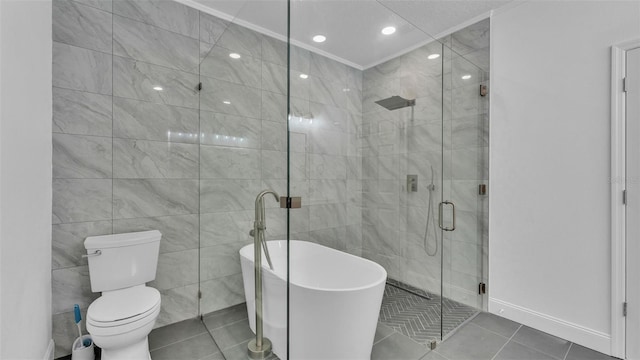 bathroom featuring a stall shower, tile walls, ornamental molding, tile patterned flooring, and a freestanding tub