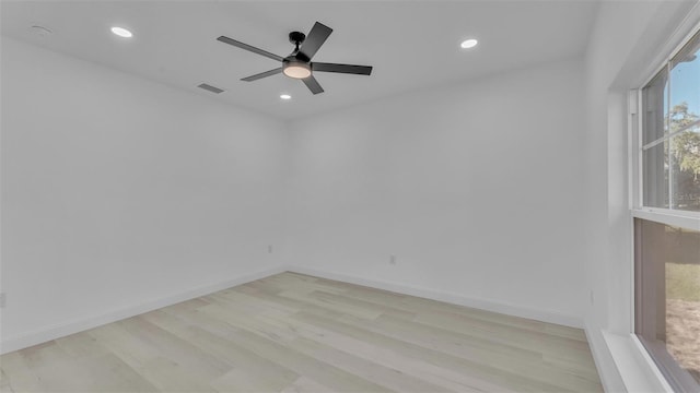 spare room featuring visible vents, light wood-style flooring, a ceiling fan, and recessed lighting