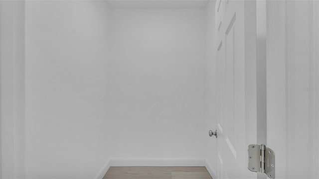 laundry room featuring baseboards