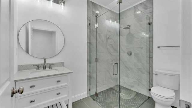 full bathroom with toilet, a stall shower, tile patterned floors, baseboards, and vanity