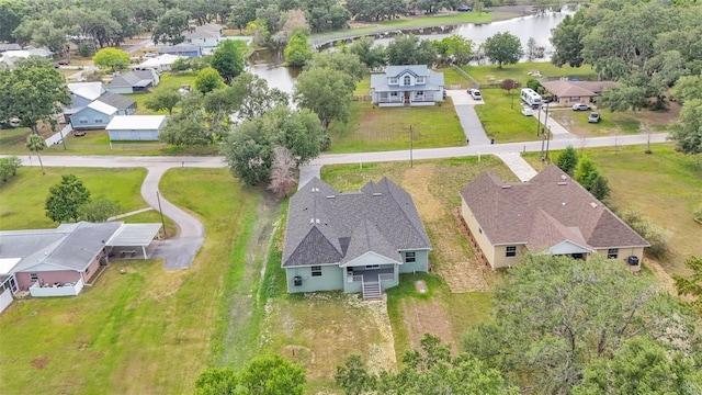 drone / aerial view featuring a water view and a residential view