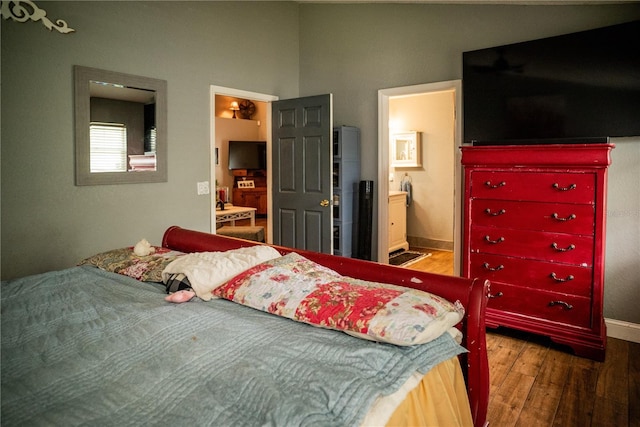811 W Heron Pl, Winter Haven, FL 33884 - bedroom with wood finished floors and ensuite bath