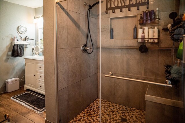811 W Heron Pl, Winter Haven, FL 33884 - full bathroom featuring vanity, a stall shower, and wood finished floors