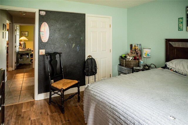 811 W Heron Pl, Winter Haven, FL 33884 - bedroom with dark wood-style flooring