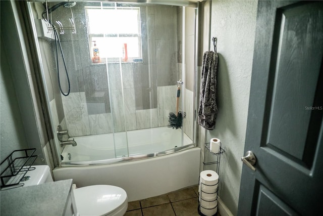 811 W Heron Pl, Winter Haven, FL 33884 - full bath featuring bath / shower combo with glass door, tile patterned floors, vanity, and a textured wall