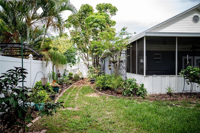 811 W Heron Pl, Winter Haven, FL 33884 - fenced backyard with a sunroom