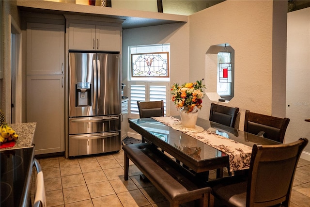 811 W Heron Pl, Winter Haven, FL 33884 - dining space featuring light tile patterned floors and a textured wall