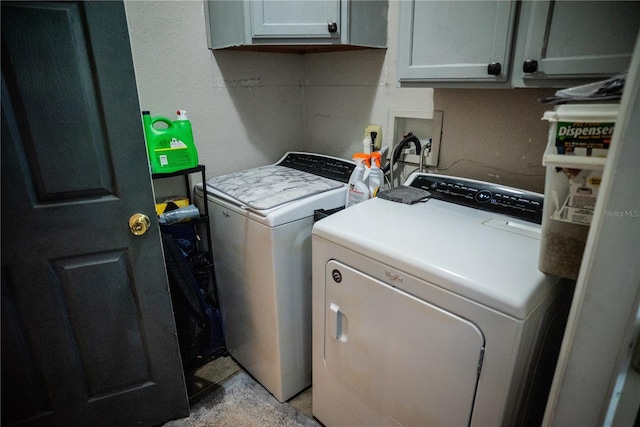 811 W Heron Pl, Winter Haven, FL 33884 - laundry area with cabinet space and washing machine and clothes dryer