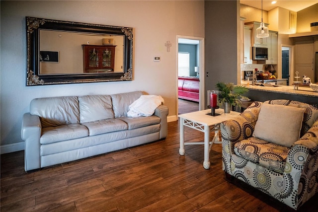 811 W Heron Pl, Winter Haven, FL 33884 - living room featuring baseboards and wood finished floors