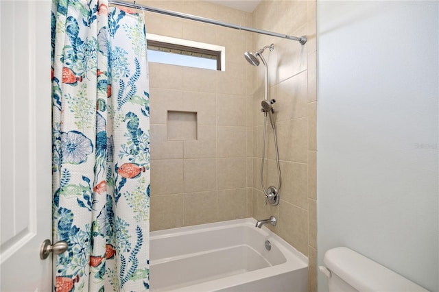 full bath featuring shower / bath combo with shower curtain and toilet