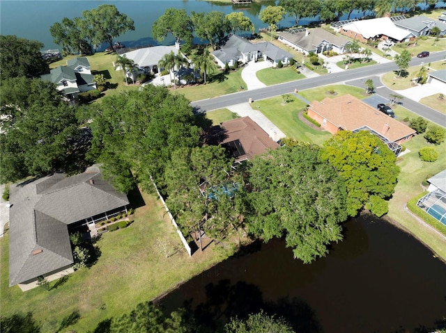 bird's eye view featuring a water view and a residential view