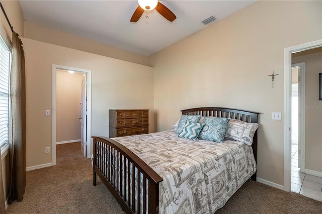 bedroom with carpet, visible vents, and baseboards