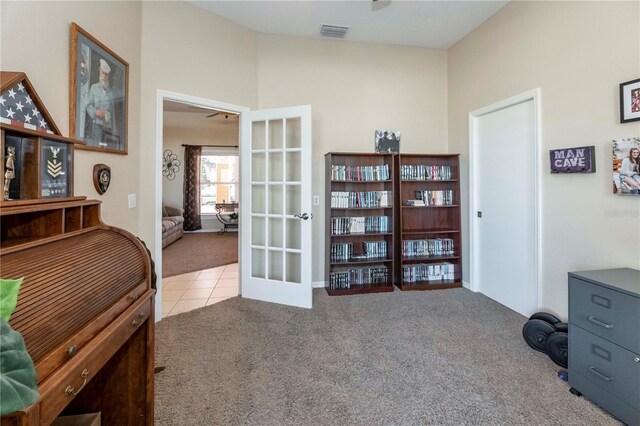 interior space with french doors, tile patterned floors, and visible vents