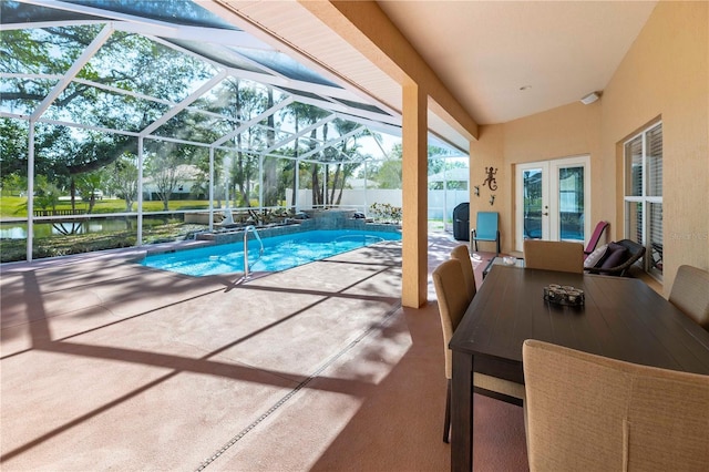 view of swimming pool featuring a fenced in pool, glass enclosure, a water view, french doors, and a patio