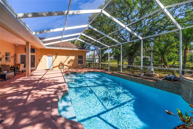 outdoor pool with a lanai and a patio
