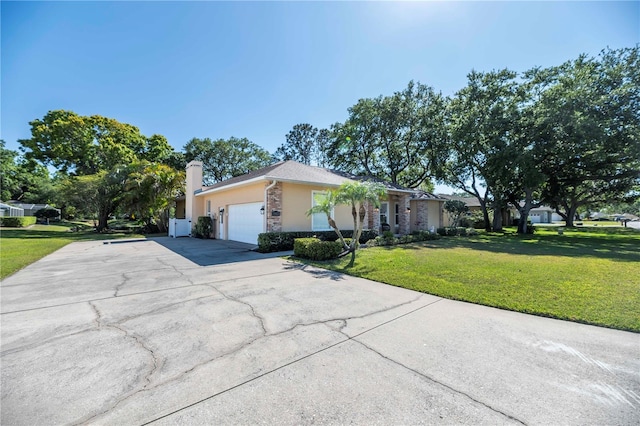 ranch-style home featuring stucco siding, concrete driveway, a front lawn, and a garage