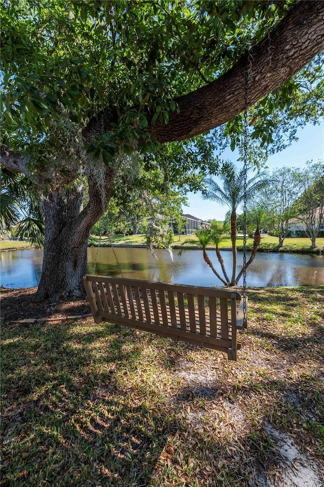 view of community with a water view