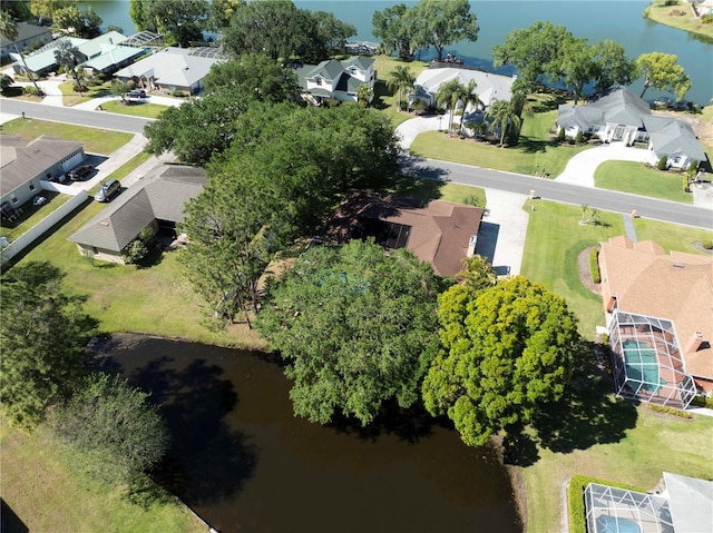 bird's eye view with a residential view and a water view