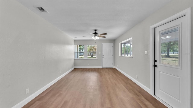 1650 W Mcleod St, Bartow, FL 33830 - unfurnished room with wood finished floors, ceiling fan, and baseboards