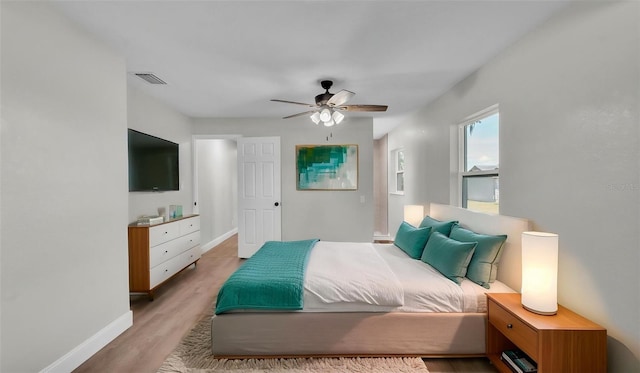 1650 W Mcleod St, Bartow, FL 33830 - bedroom featuring baseboards, light wood-type flooring, and ceiling fan
